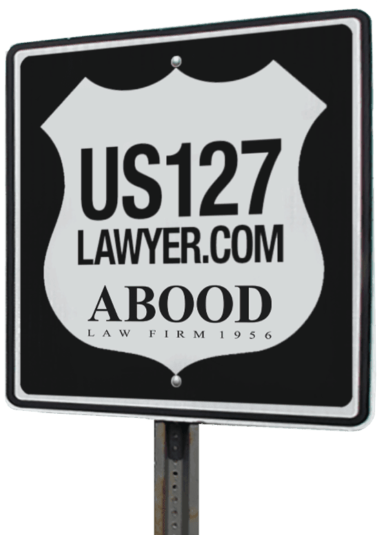 Highway sign with US127Lawyer.com website address and Abood Law Firm Logo