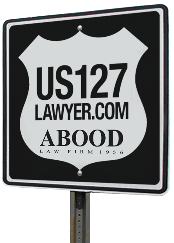 Highway sign with US127Lawyer.com website address and Abood Law Firm Logo